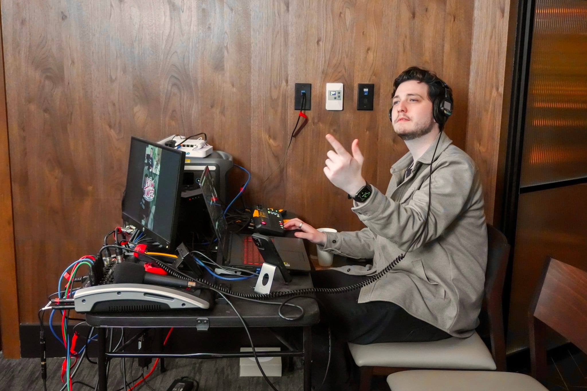 Travis Flesher at the engineering desk during an on-location session