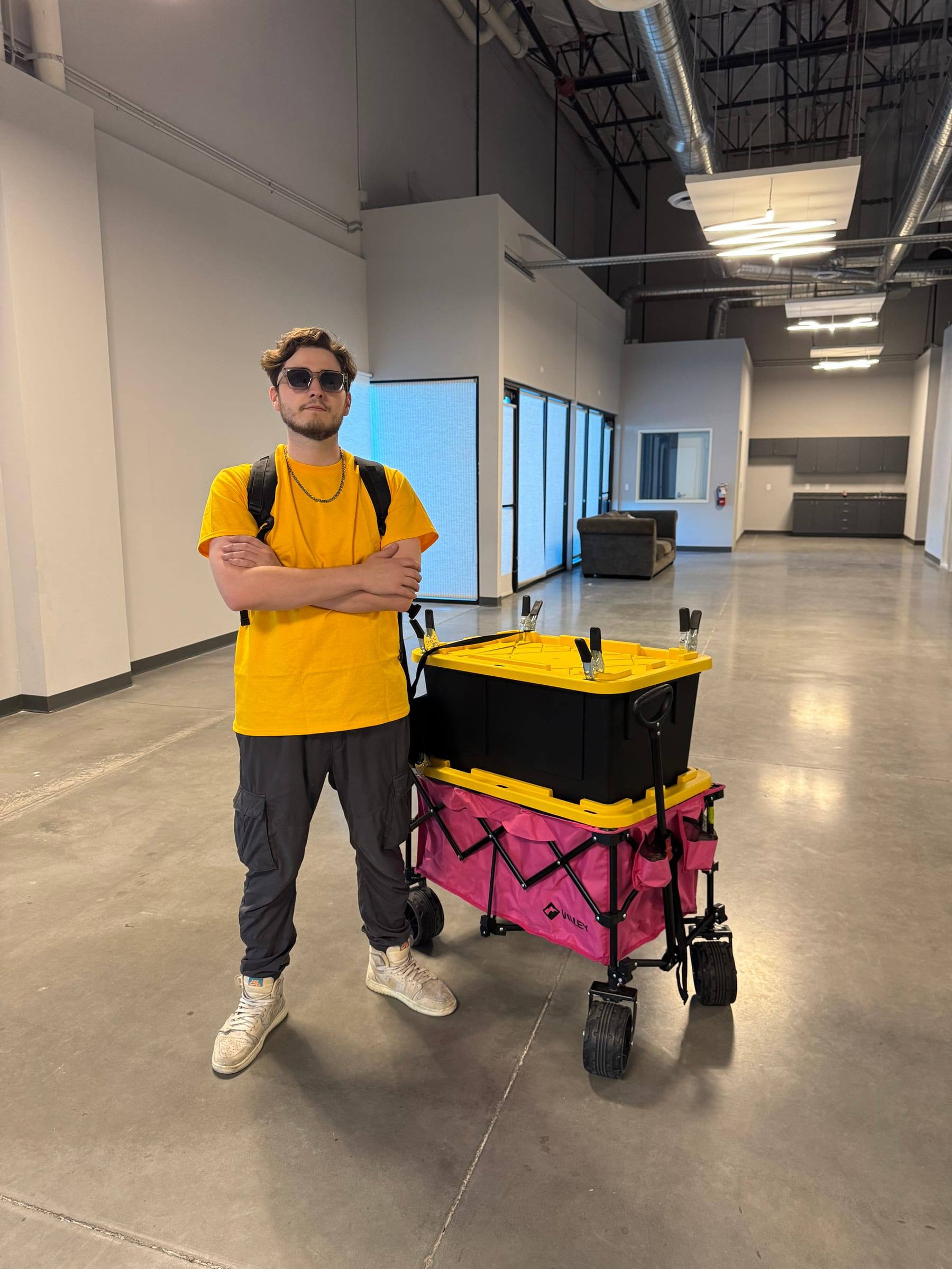 Travis Flesher standing next to the whole kit on one cart